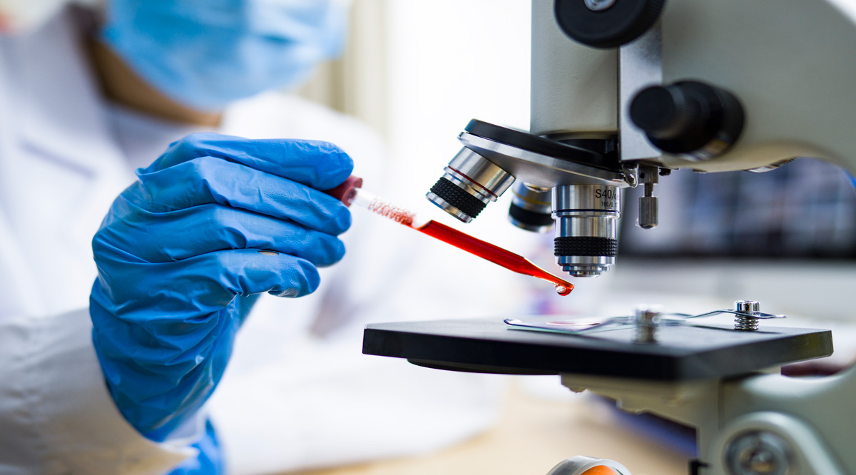 Covid-19 Research person using microscope