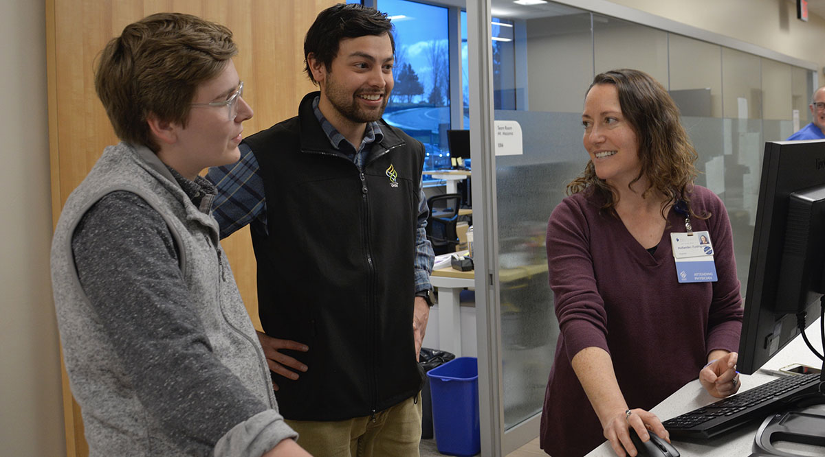 Alix Cooper, left, is graduating early from Oregon Health & Science University School of Medicine. Pictured with her are German Ferrer, a student who is also graduating early, and residency program director Joyce Hollander-Rodriguez, MD