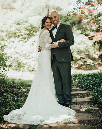 Newly married couple Jacque and Sean Murray standing at a park