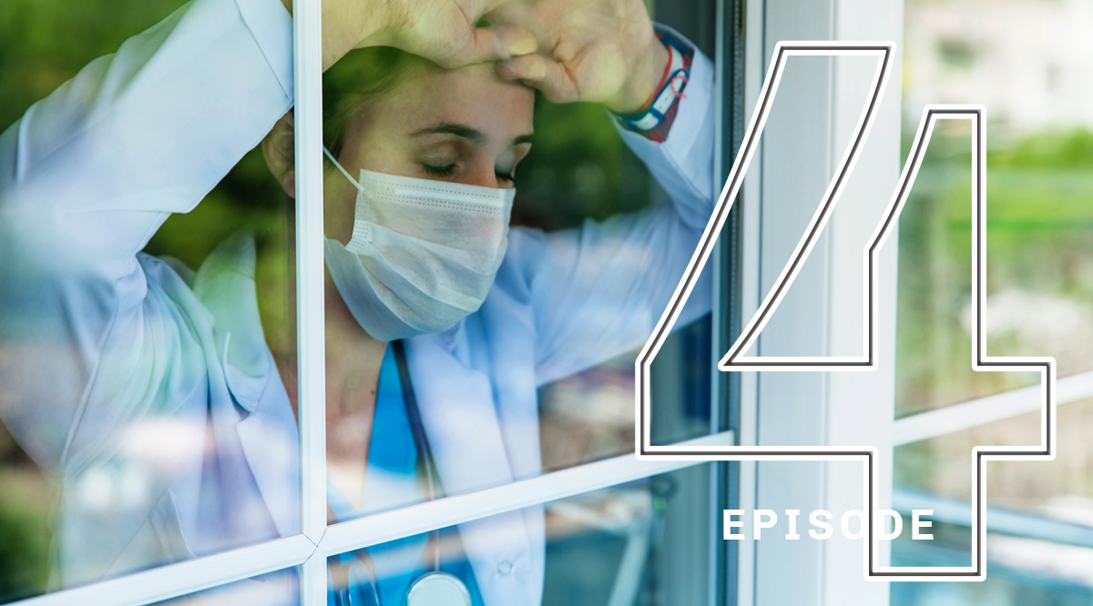 Worried female doctor with arms raised and leaning in the hospital window