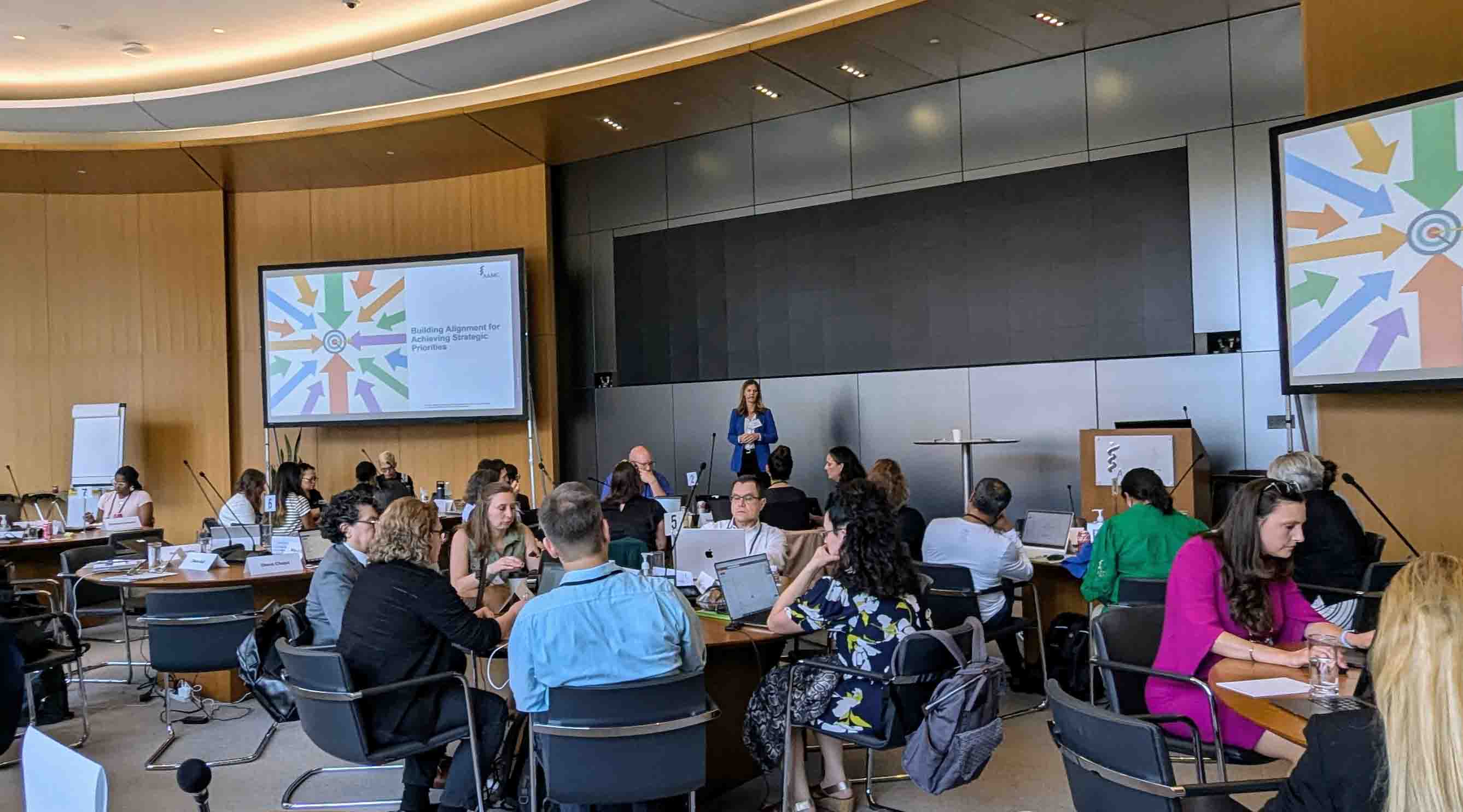 A group of workshop participants in a lecture hall.
