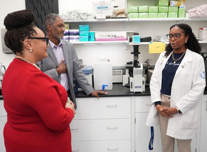 A medical student presents research to leadership.