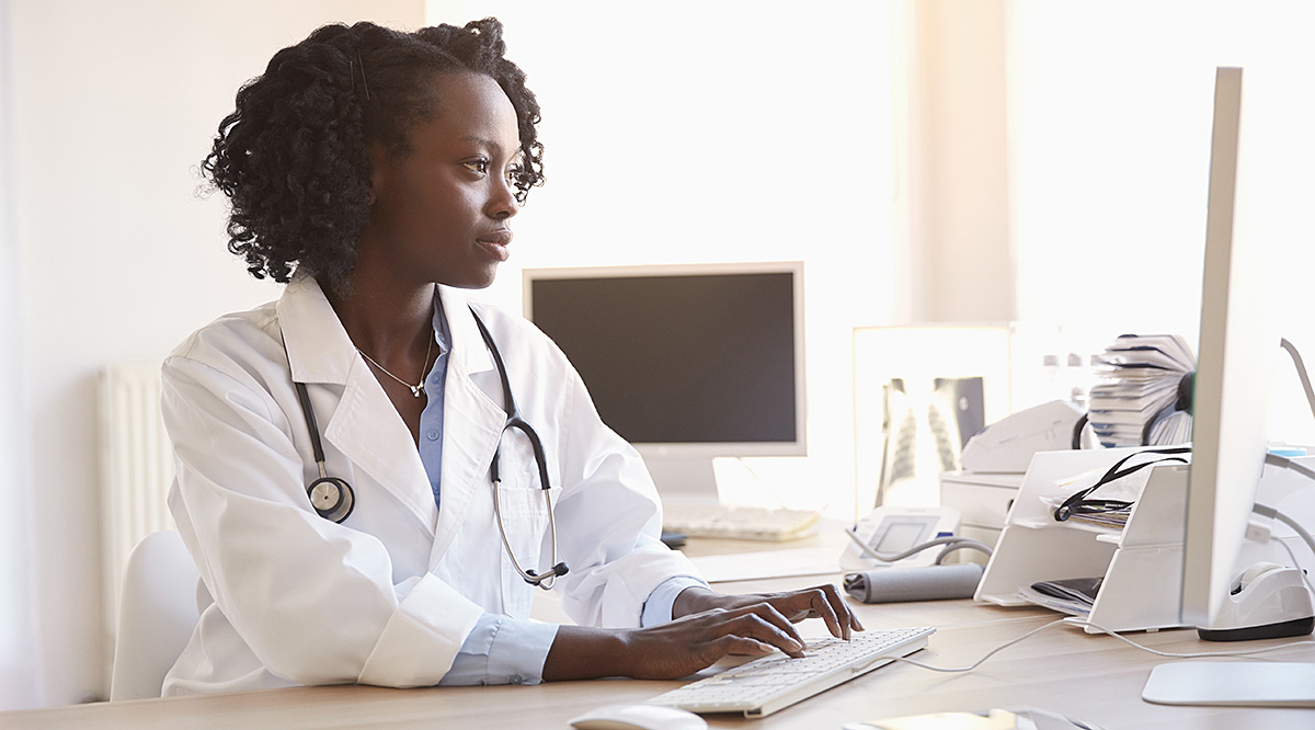 A group of doctors and medical professionals discussing a topic in a meeting