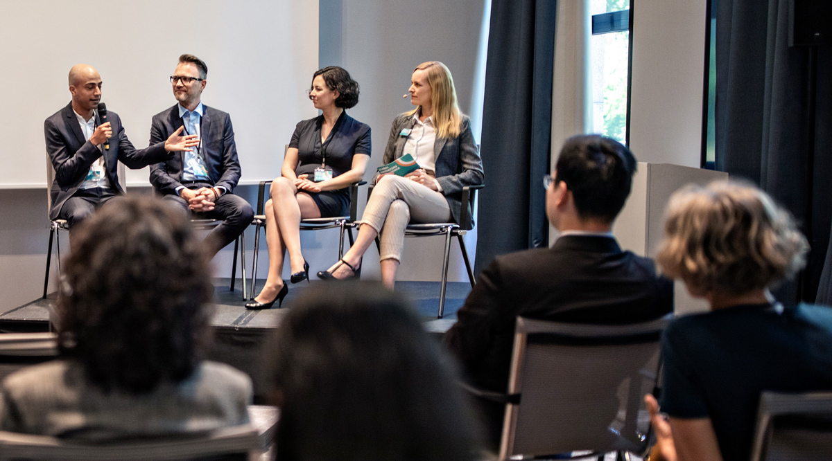 A group of doctors and medical professionals discussing a topic in a meeting