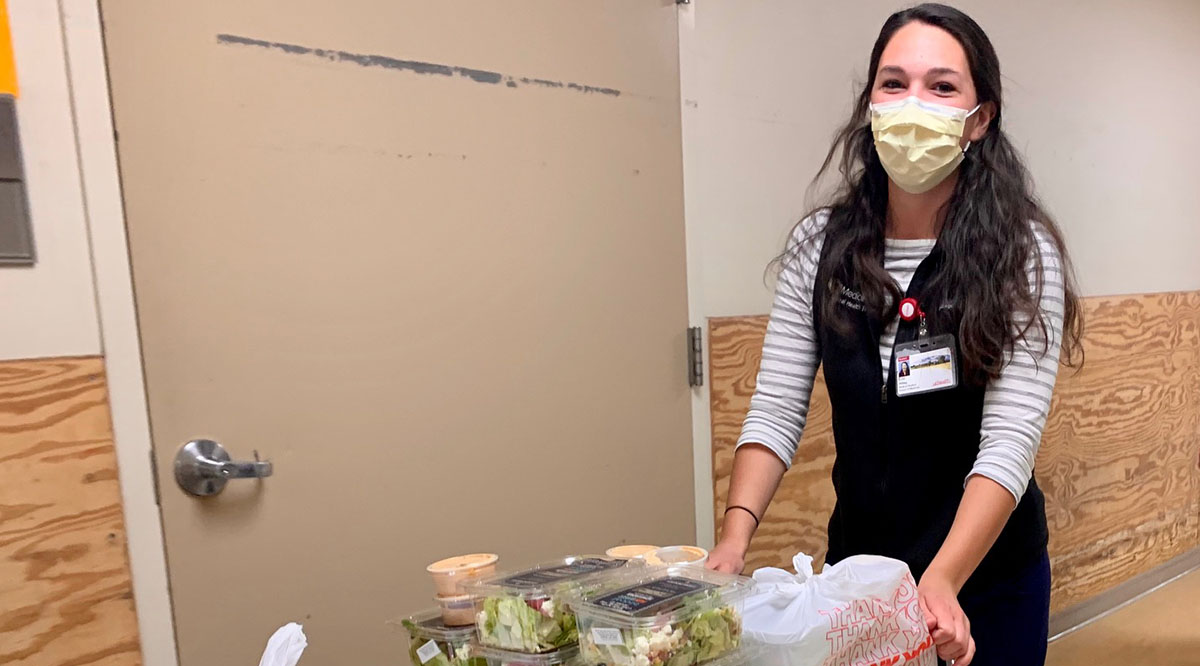 Fourth-year University of Colorado medical student Erin Aldag delivers donated meals to doctors and nurses in the UCHealth University of Colorado Hospital before the night shift one day last week