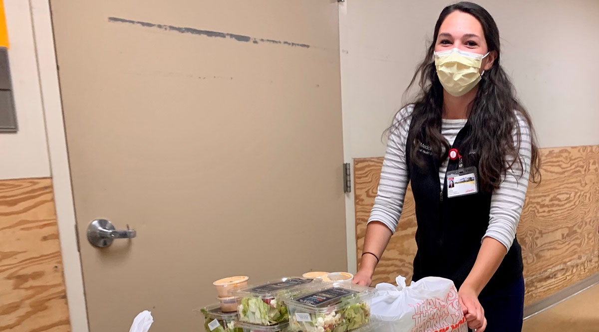 ErinAldag_DeliveringFood Fourth-year University of Colorado medical student Erin Aldag delivers donated meals to doctors and nurses in the UCHealth University of Colorado Hospital before the night shift one day last week