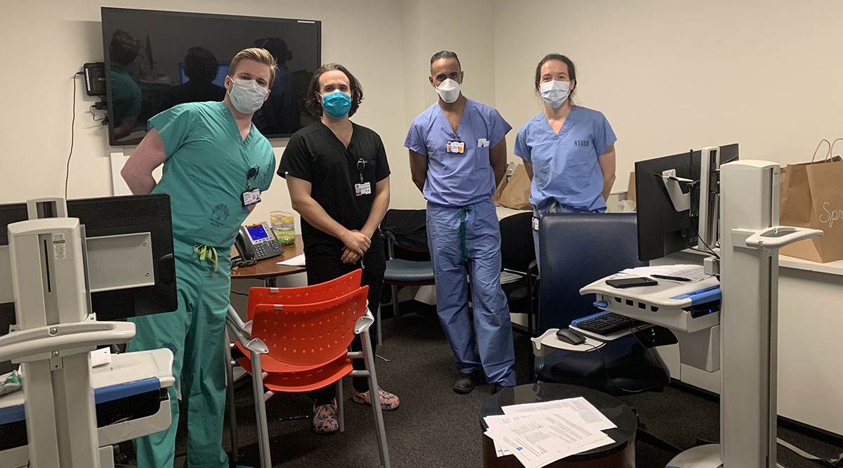 Jaison John, MD, second from right, a hospitalist with the University of Texas at Austin Dell Medical School, is shown with his team at NYU Langone Health. John volunteered to care for COVID-19 patients at NYU Langone for a week in early April