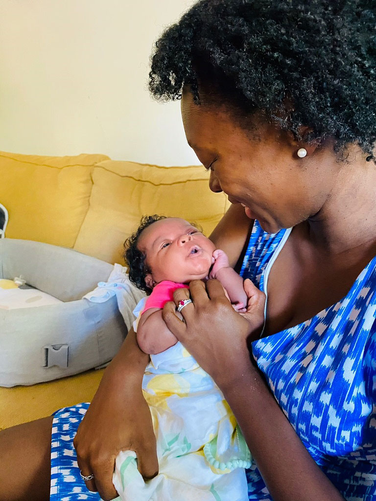 Marlise Pierre-Wright, a third-year medical student at Northwestern University Feinberg School of Medicine in Chicago, holds her daughter, Camille.