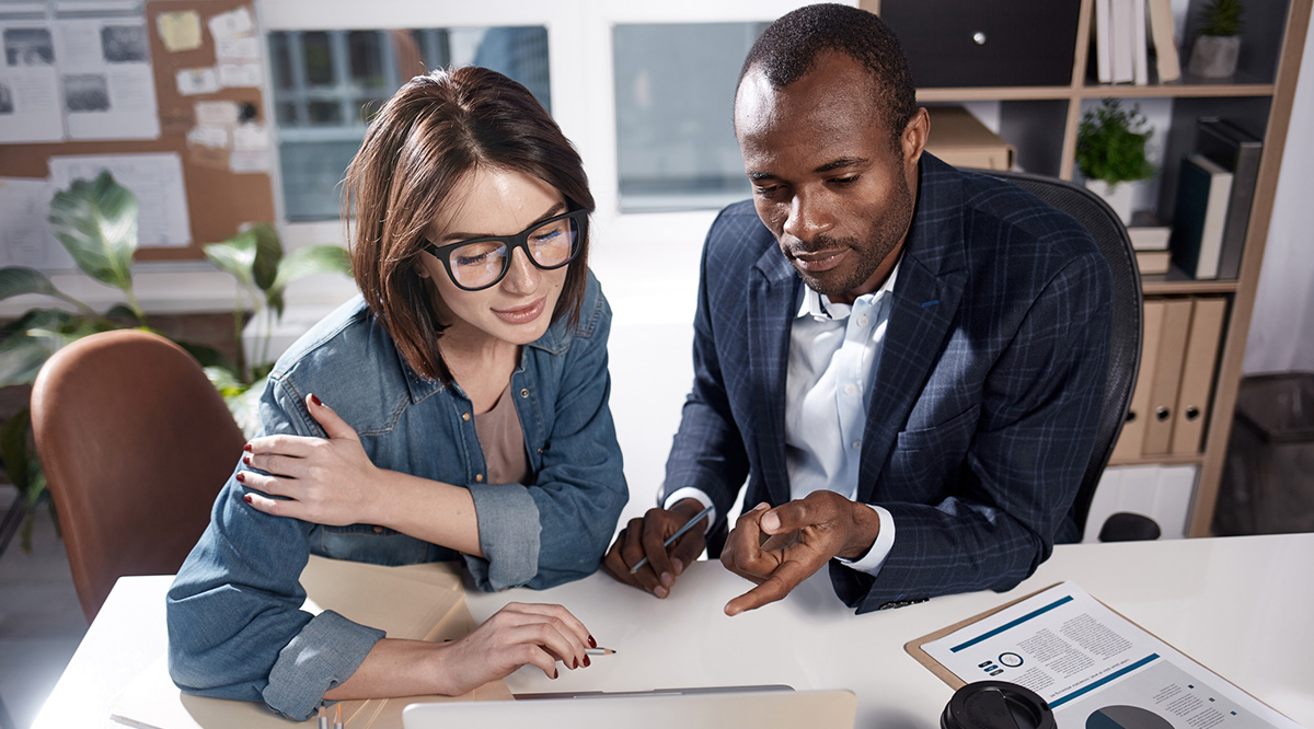 StandPoint Surveys Staff A woman and a man review papers together.
