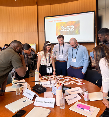 Attendees from July 2025 RISE event during group activity
