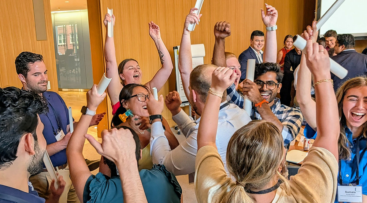 Attendees from July 2025 RISE event celebrating