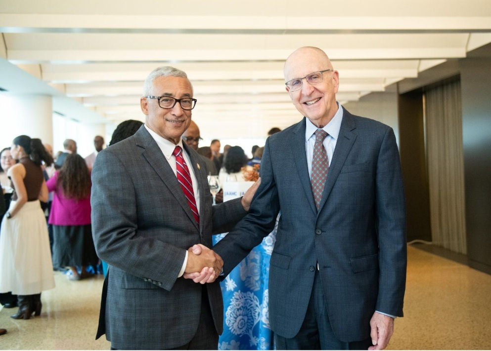 AAMC leadership shaking hands with politician