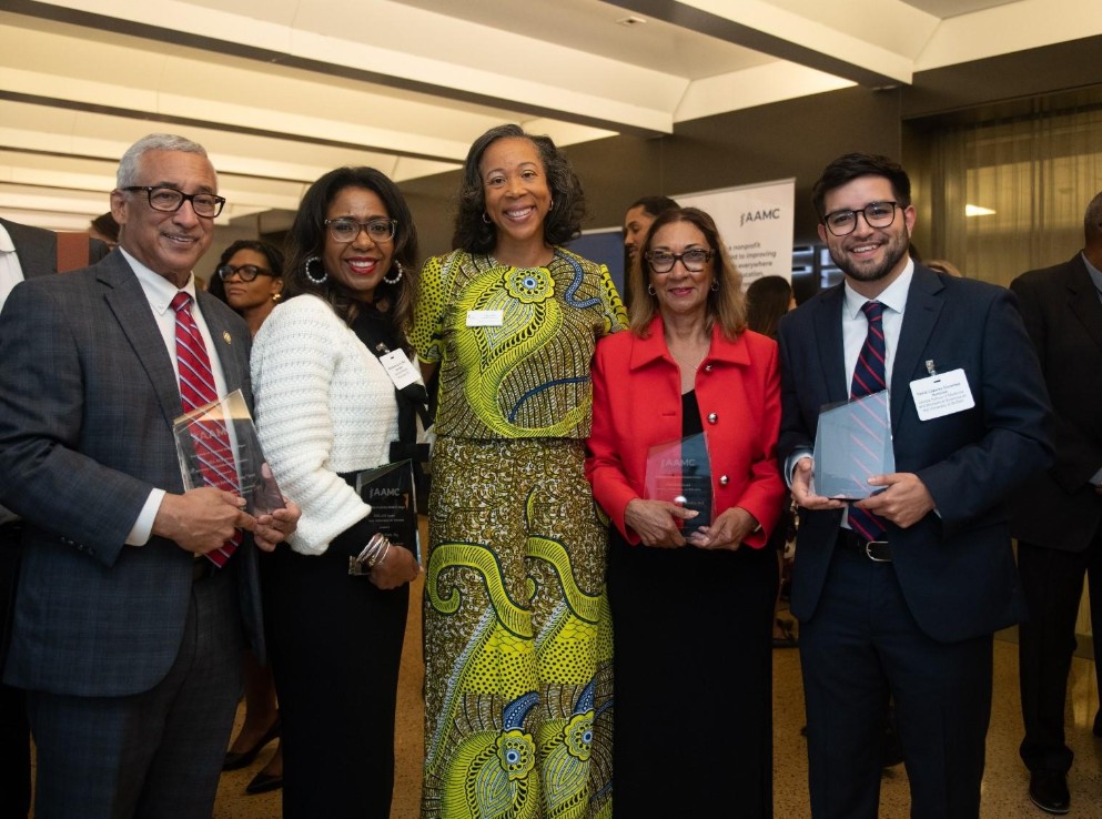 AAMC leadership poses with awards