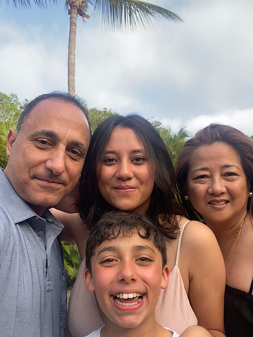 Ashraf Elsayegh, MD, poses with his wife, his 18-year-old daughter, and his 12-year-old son.