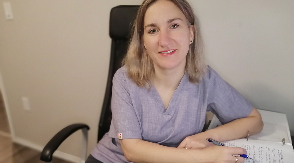 Lydia Greene studying her nursing notes at home. When her children were small, Green was skeptical of vaccines, but now advocates for evidence-based medicine.