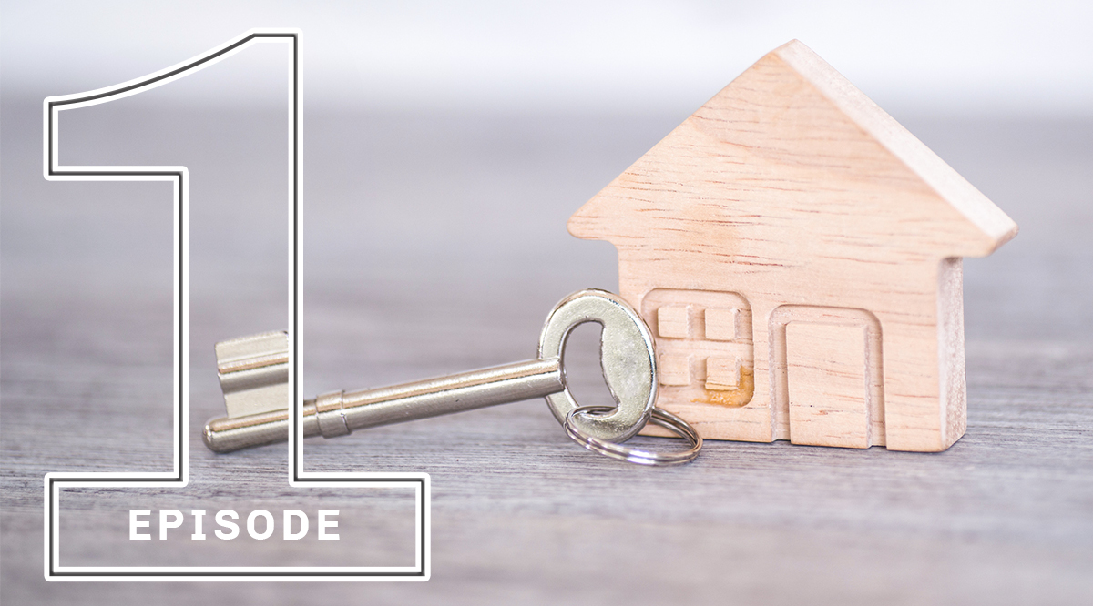 A key with a miniature wooden house