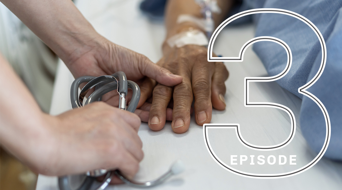 A health practitioner's hand holding a patient's hand