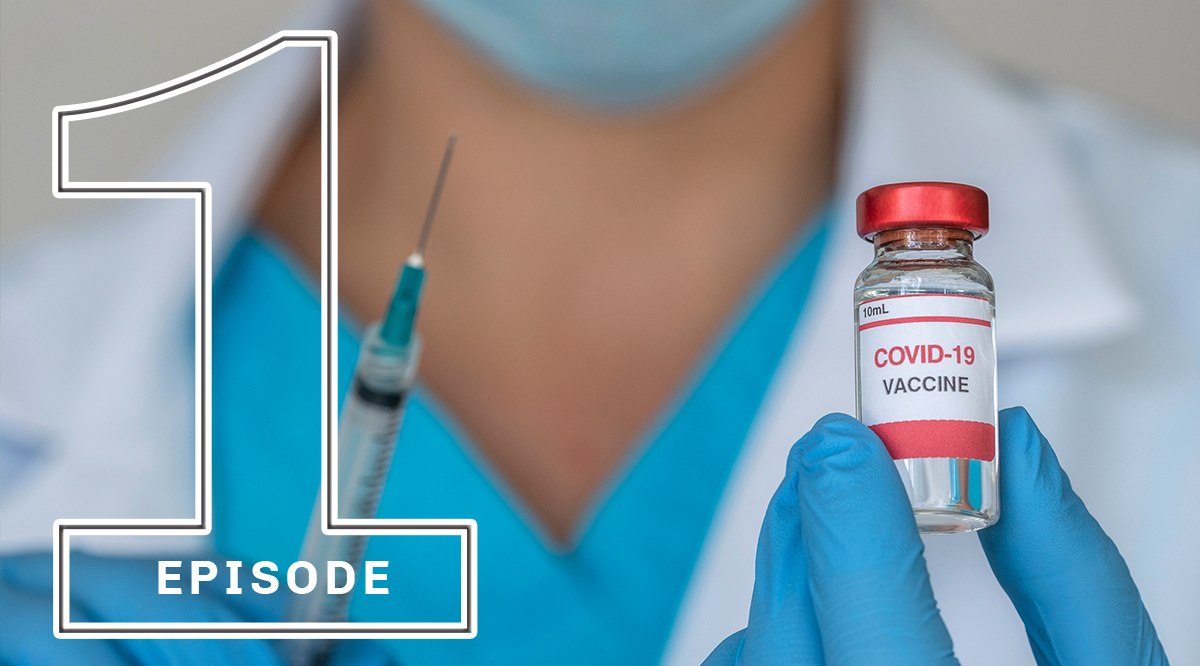 Close-up of doctors hands holding Covid-19 vaccine and syringe