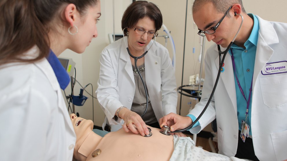 Students practice skills on a mannequin at the New York Simulation Center