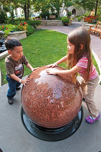 children playing in a fountain