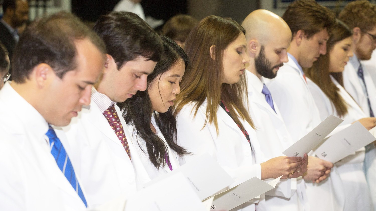 During a White Coat Ceremony, the University of South Alabama College of Medicine class of 2021 begins their training with a commitment to provide compassionate patient care. Credit: USA College of Medicine White coat ceremony