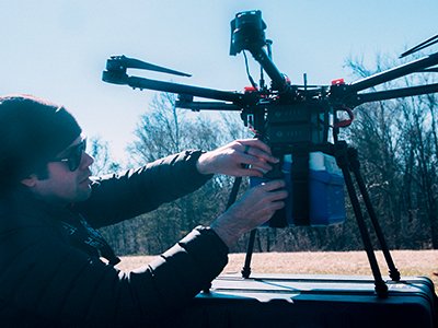 Jeff Street, a drone engineer at Johns Hopkins University School of Medicine, prepares the drone for flight. Credit: Johns Hopkins Medicine Jeff Street preparing drone for flight