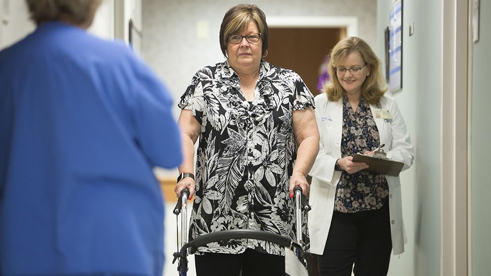 Staff measure a patient’s gait speed in a Duke University Medical Center program that helps patients gear up for surgery.