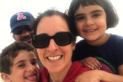 Monique Tello, MD, MPH, with her husband and children