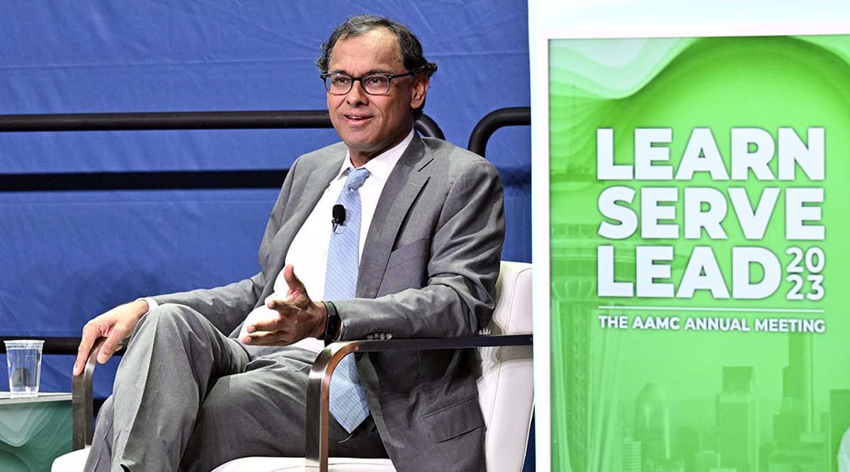Sandeep Jauhar, MD, PhD, speaks to the audience while seated on stage at Learn Serve Lead 2023.