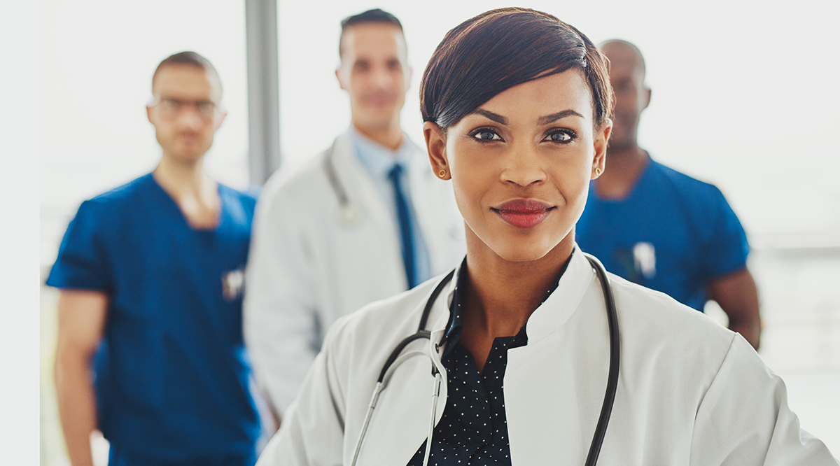 Black female doctor leading medical team