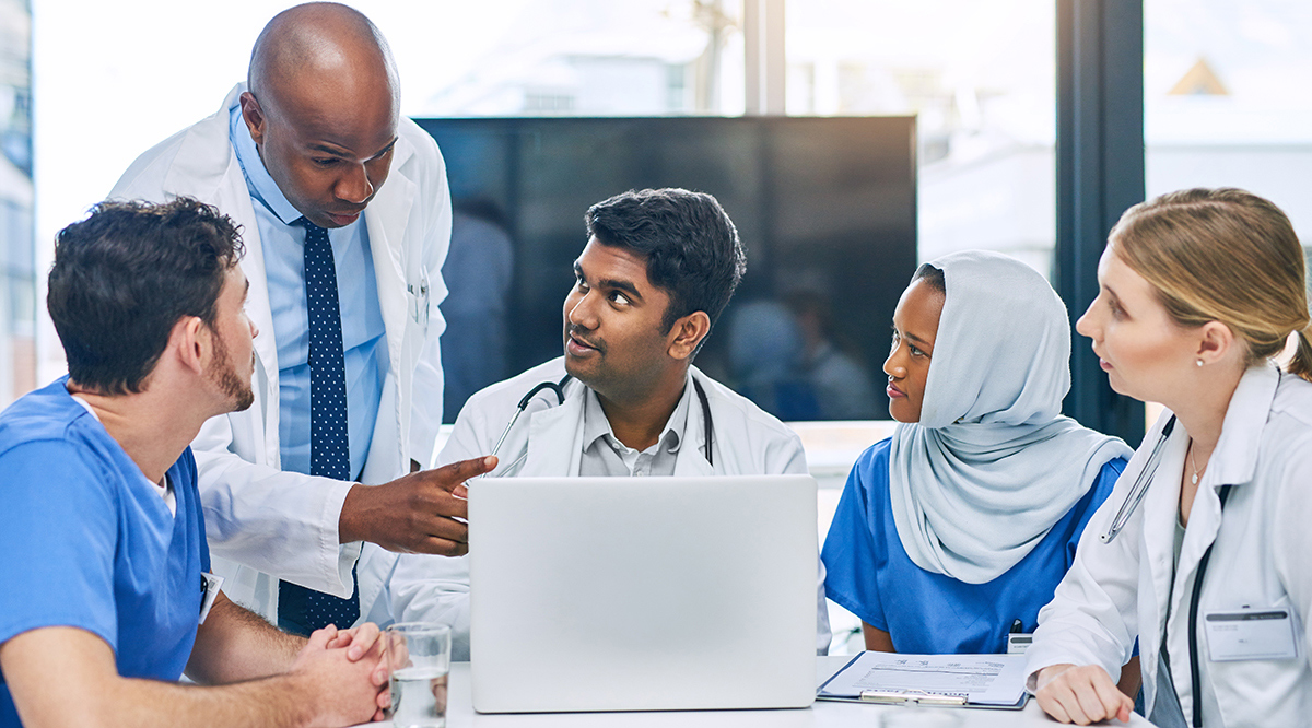 A group of diverse physicians in a discussion