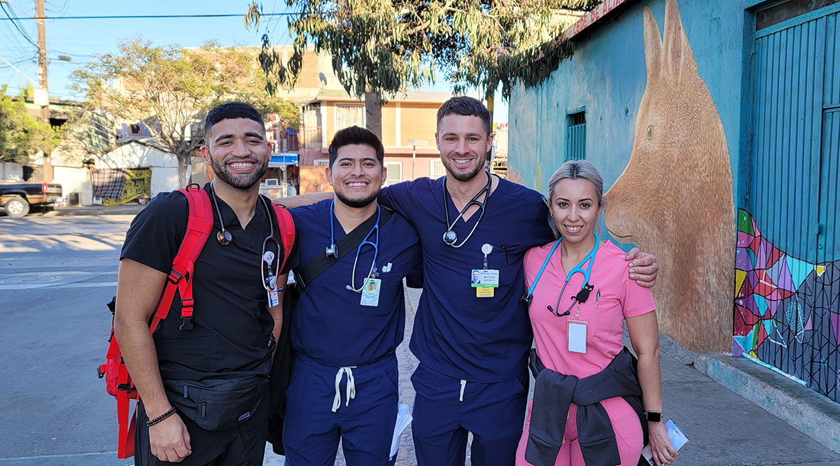 UArizona College of Medicine - Phoenix volunteers in Tijuana, Mexico, before their afternoon clinic. Left to right: Kevin Salas, RN '22; Andrew Acosta '25; Matthew Campanella '23; Kelly Chavez, FNP.