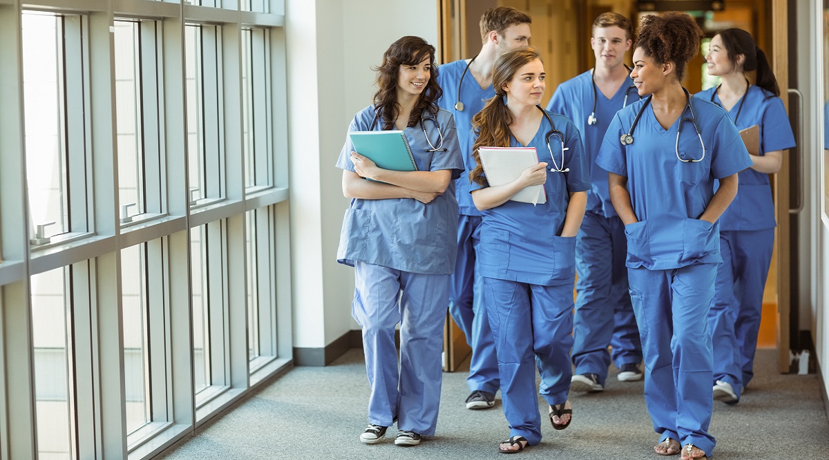 Medical students walking through corridor at the university