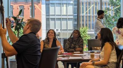 A small group of participants work on an activity.