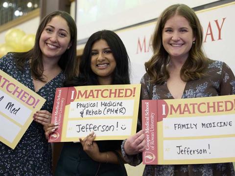 Three medical students pose for a picture on Match Day. 