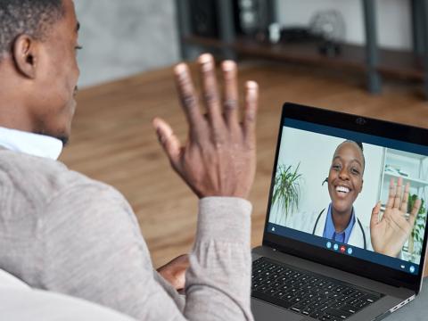 Patient talking on conference video call to doctor
