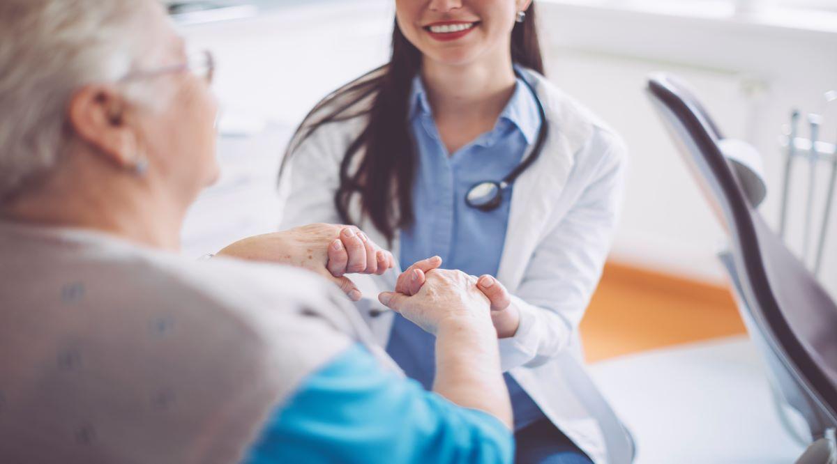 doctor holding patient hands