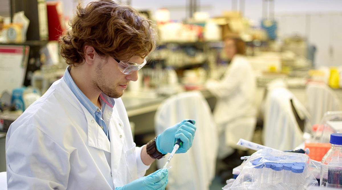 Scientist using micro pipette with DNA