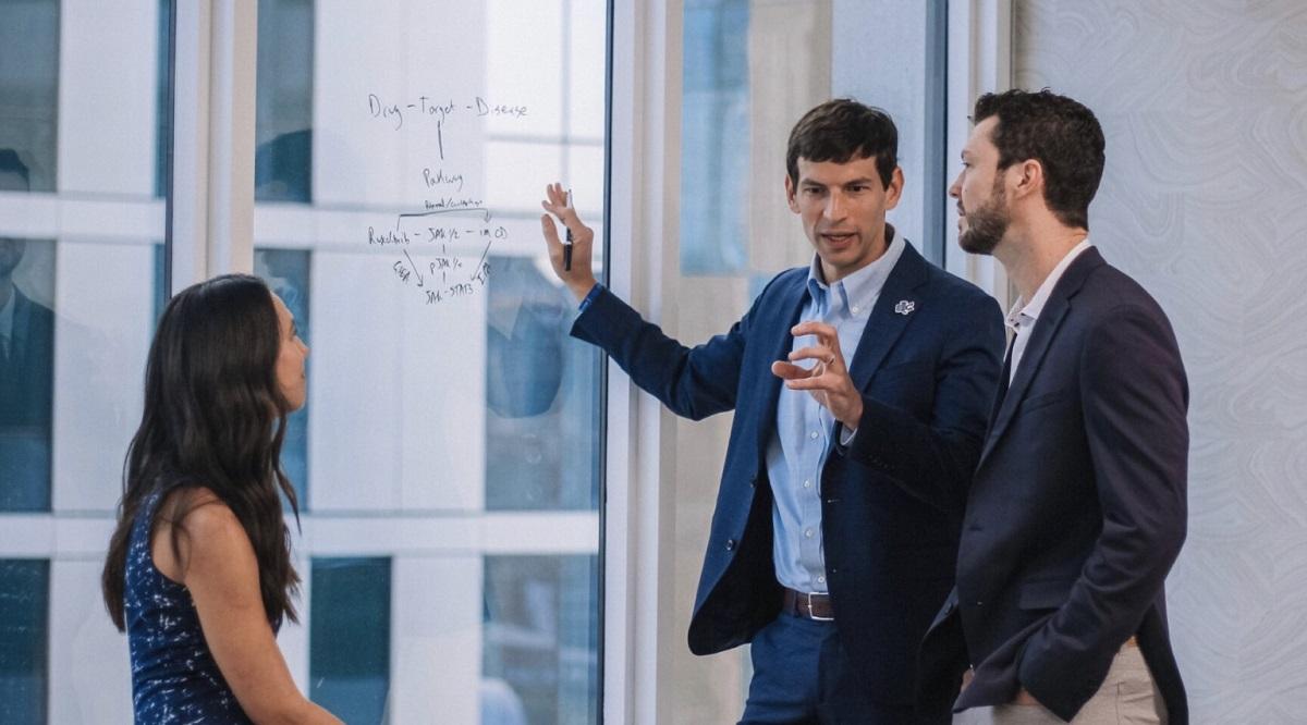 David Fajgenbaum working with his team