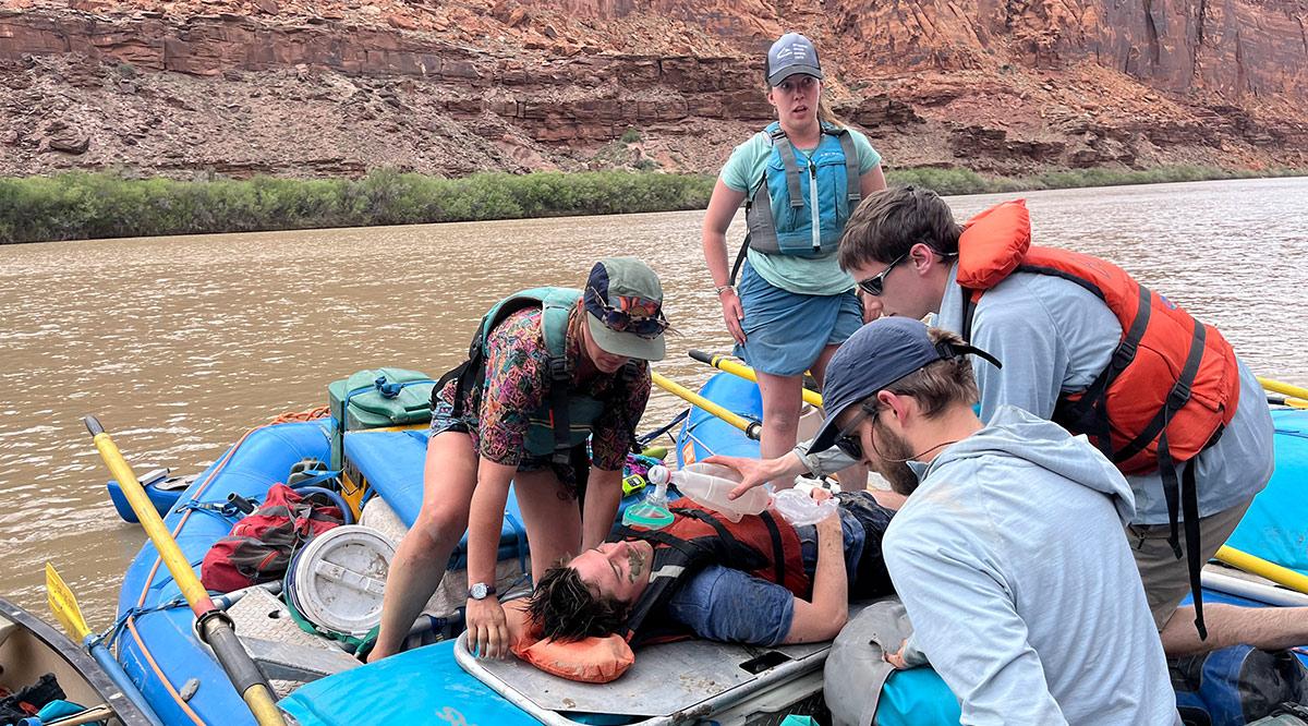 Eric Macaluso, DO, practices rescue techniques on Colorado’s Green River during a training