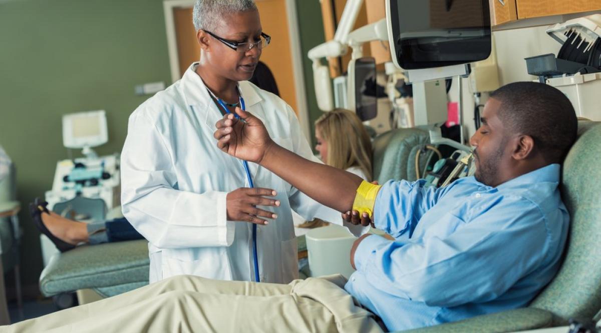 8-redbox-community-benefit_image_doctor_helping_clinic.jpg__992x558_q85_crop-smart_subsampling-2_upscale