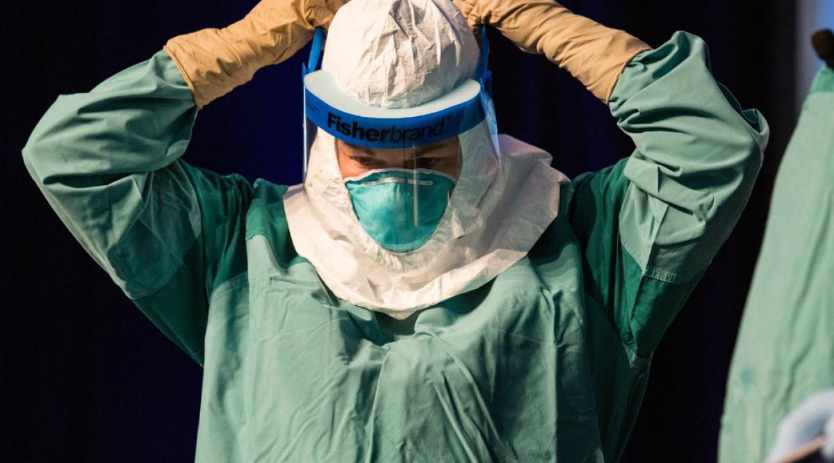 83-ebola-hero-image-woman-in-suit.jpg__992x558_q85_crop-smart_subsampling-2_upscale