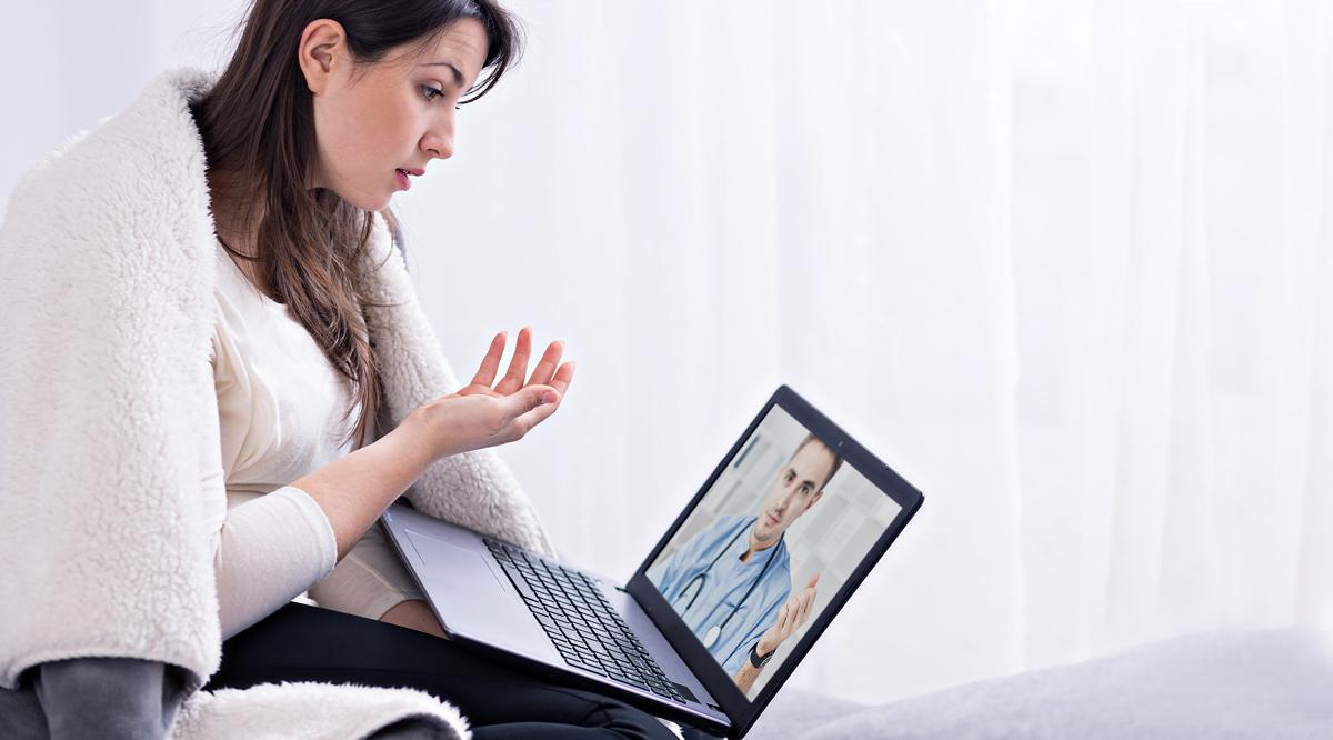 A woman having an on-line discussion with her doctor