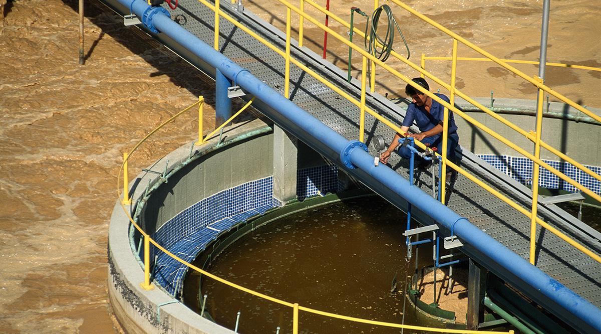 Worker in water treatment plant