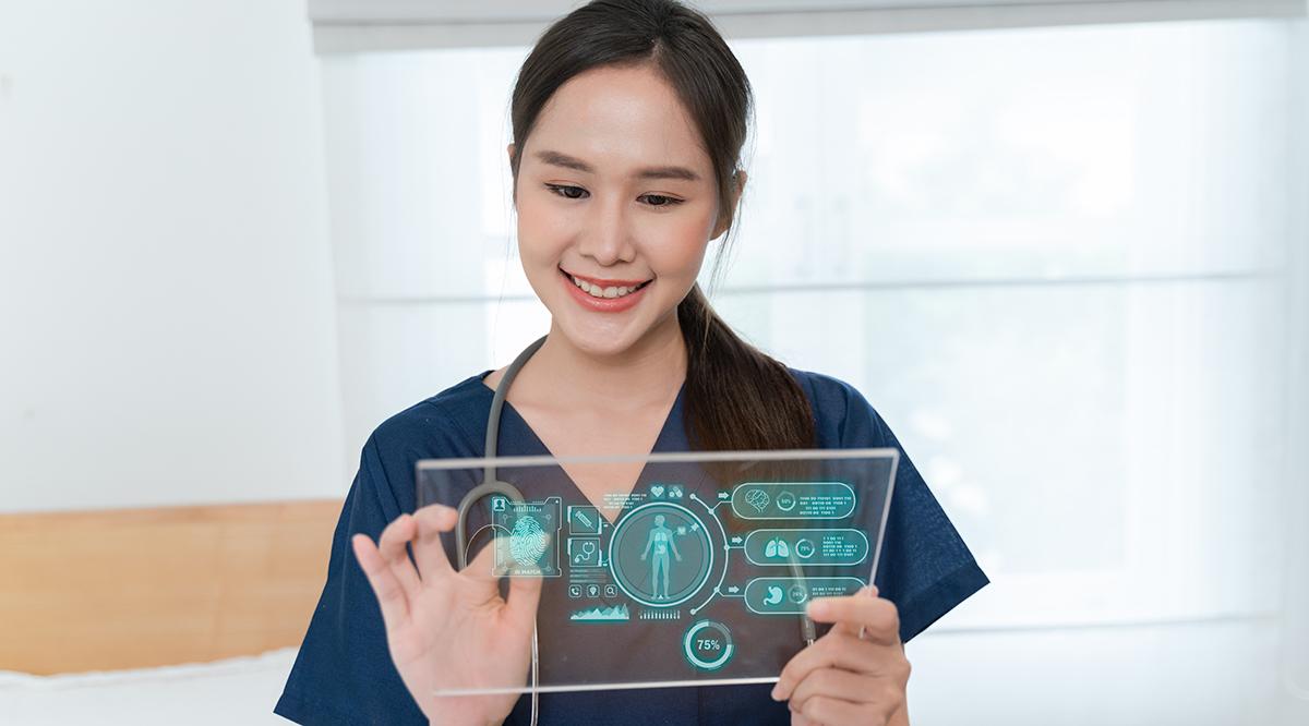 Young female doctor looking at a screen that shows a digital overlay data in virtual reality.