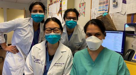 Hemali Patel, MD, (in green scrubs), a hospitalist with the University of Texas at Austin Dell Medical School, poses with her team at NYU Langone Health. Patel spent a week volunteering to care for patients at NYU Langone