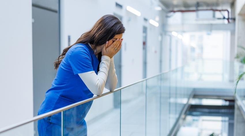 Female healthcare worker experiencing emotional burnout and stress