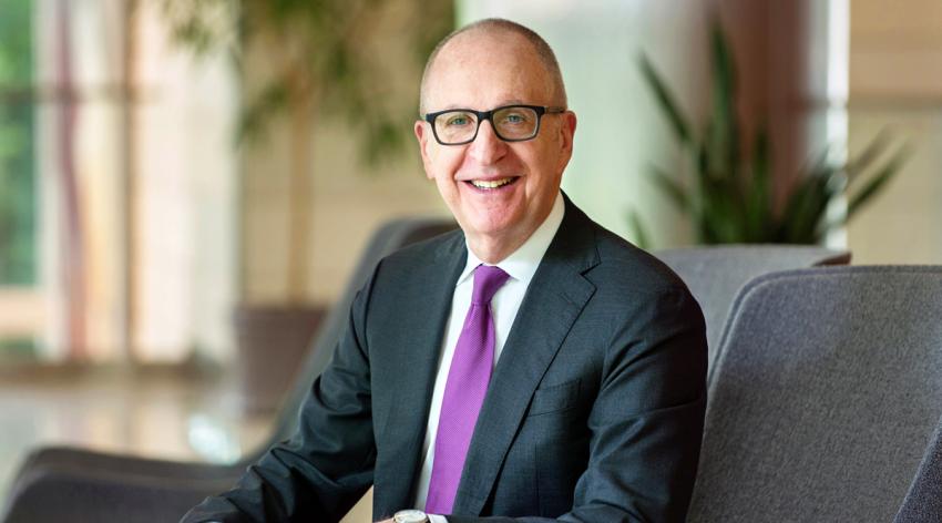 David J. Skorton, MD sitting on a chair