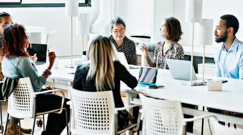 A diverse group of people meeting in an office