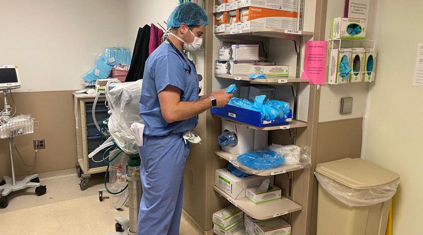 Jake Kieserman, a third-year student at the Lewis Katz School of Medicine at Temple University, suits up for his surgery clerkship on one of his first days back